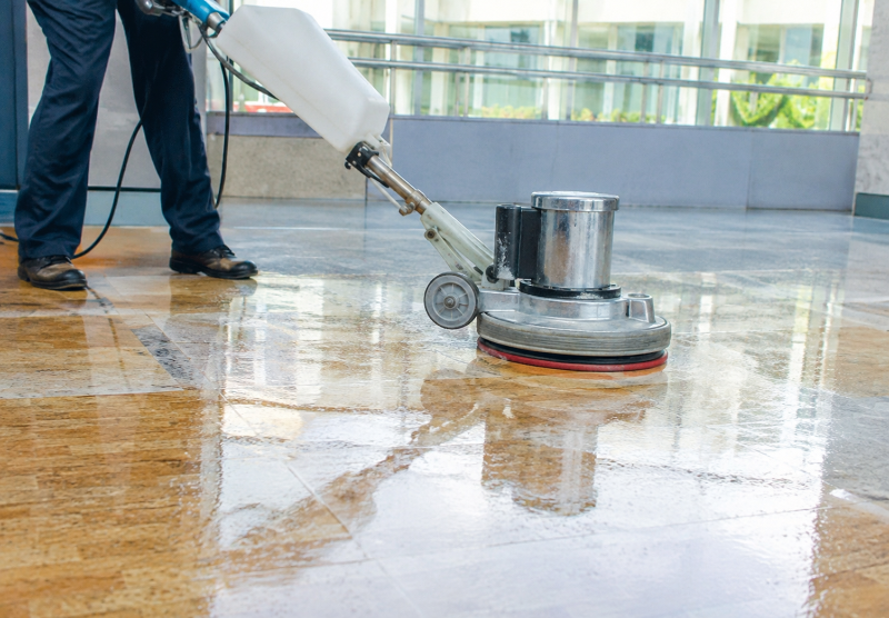 Professional floor finish application in a commercial retail space